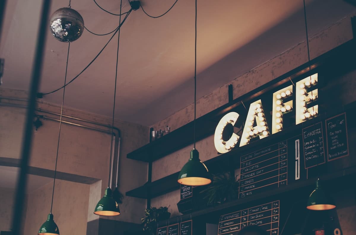 Fresh coffee beans next to a cup of espresso